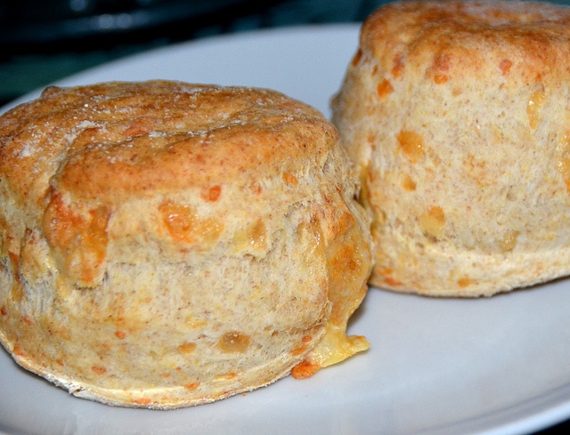 two whole cheese scones on a plate