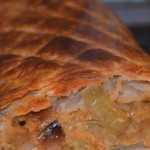 whole onion and lentil filling in a pastry casing