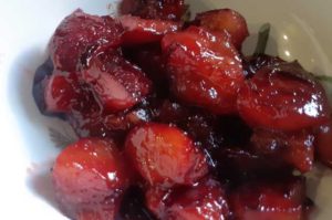 red-stewed-plums-in-a-bowl