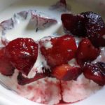 red-stewed-plums-in-bowl-with-cream