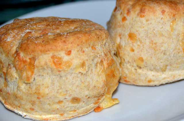 two whole cheese scones on a plate