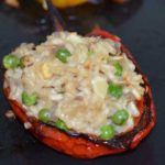 red half pepper stuffed with rice