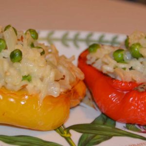 red and yellow half pepper stuffed with rice and peas