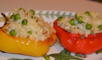 red and yellow half pepper stuffed with rice and peas