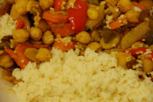 Chickpeas, peppers, carrots and almonds recipe with spices with Couscous