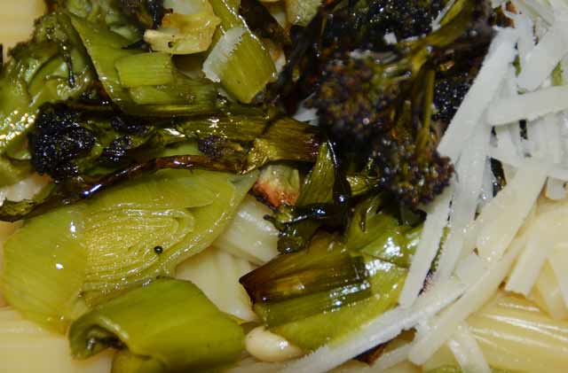 purple sprouting broccoli on a bed of pasta