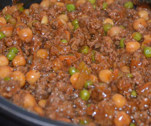 plate of beef mince with peas and vegetables