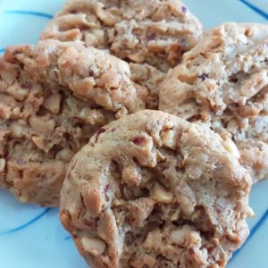 four small peanut butter biscuits on a plate