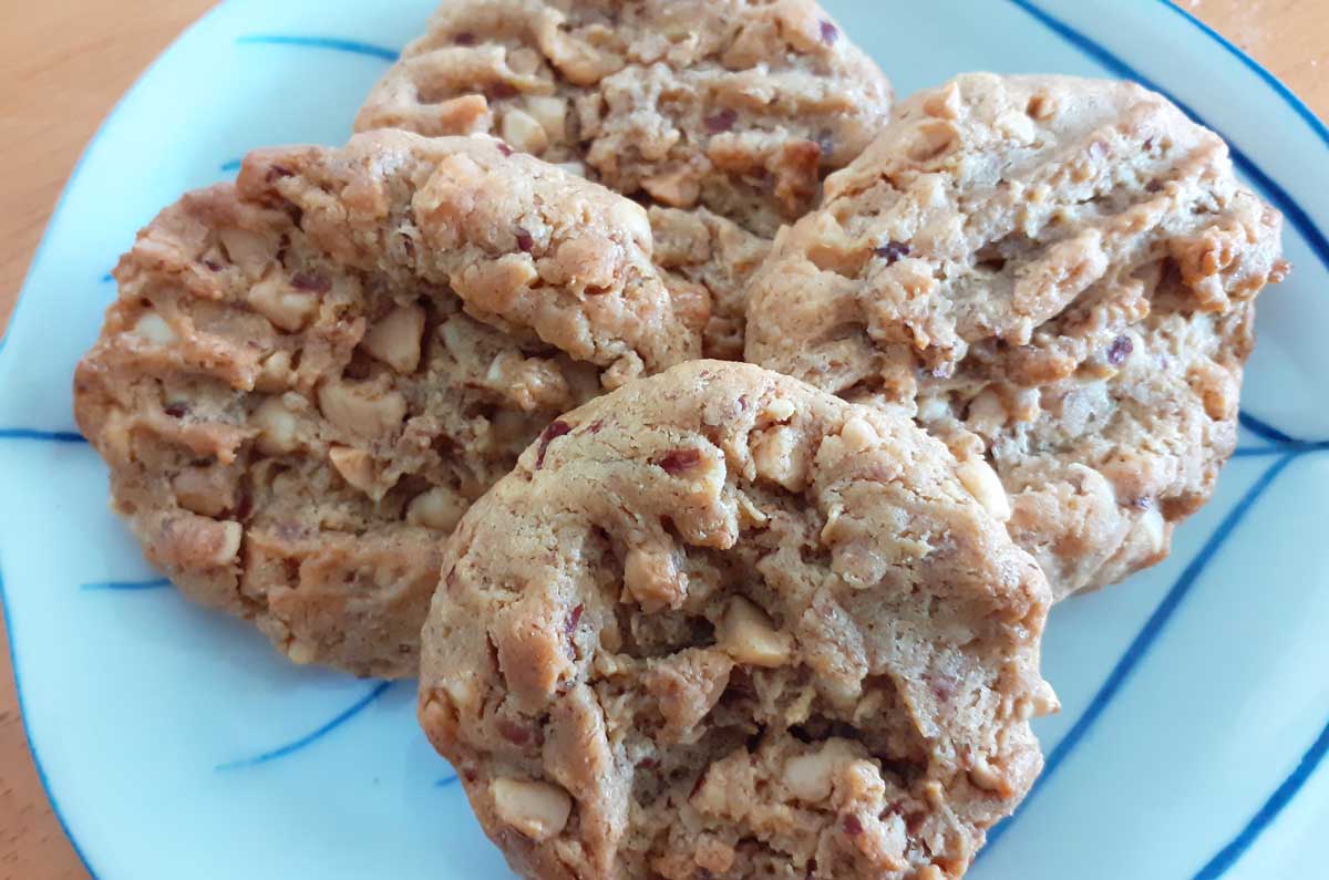 four small peanut butter biscuits on a plate