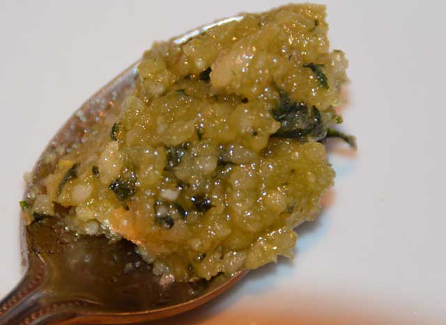 Basil leaves, pinenuts and parmesan in olive oil pressed into a paste
