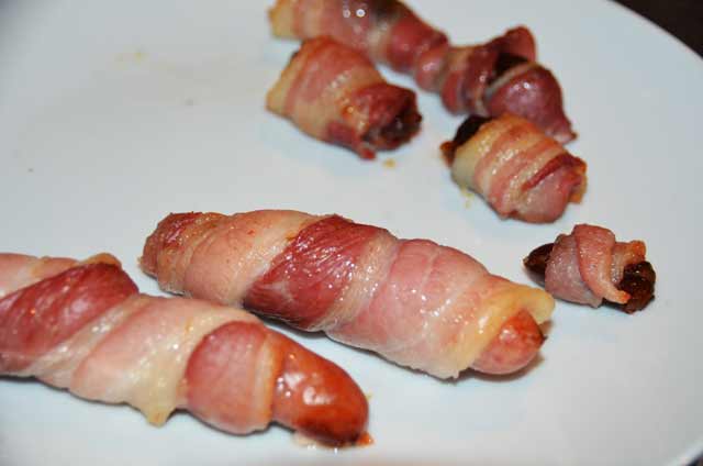 sausages wrapped in bacon and dates wrapped in bacon