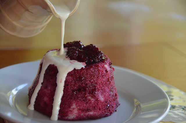 summer-pudding-with-cream-being-poured-over