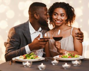 man and woman sharing a romantic meal