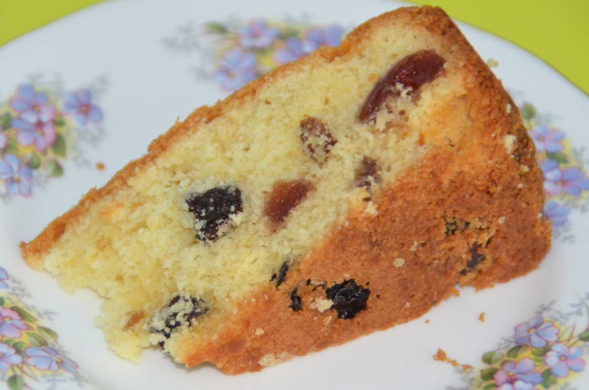 single slice-fruit and lemon cake showing fruit pieces