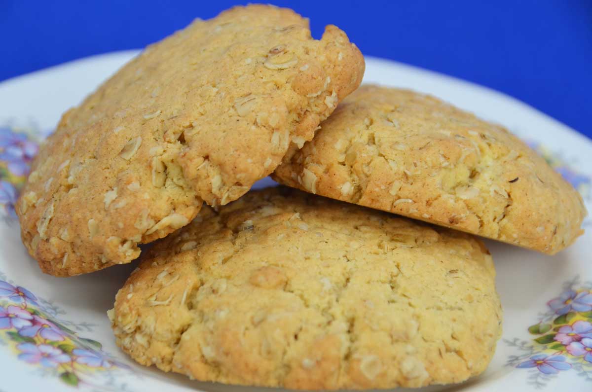 three oat biscuits on a floral plate