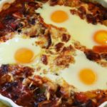 four eggs in a tomato and pepper sauce