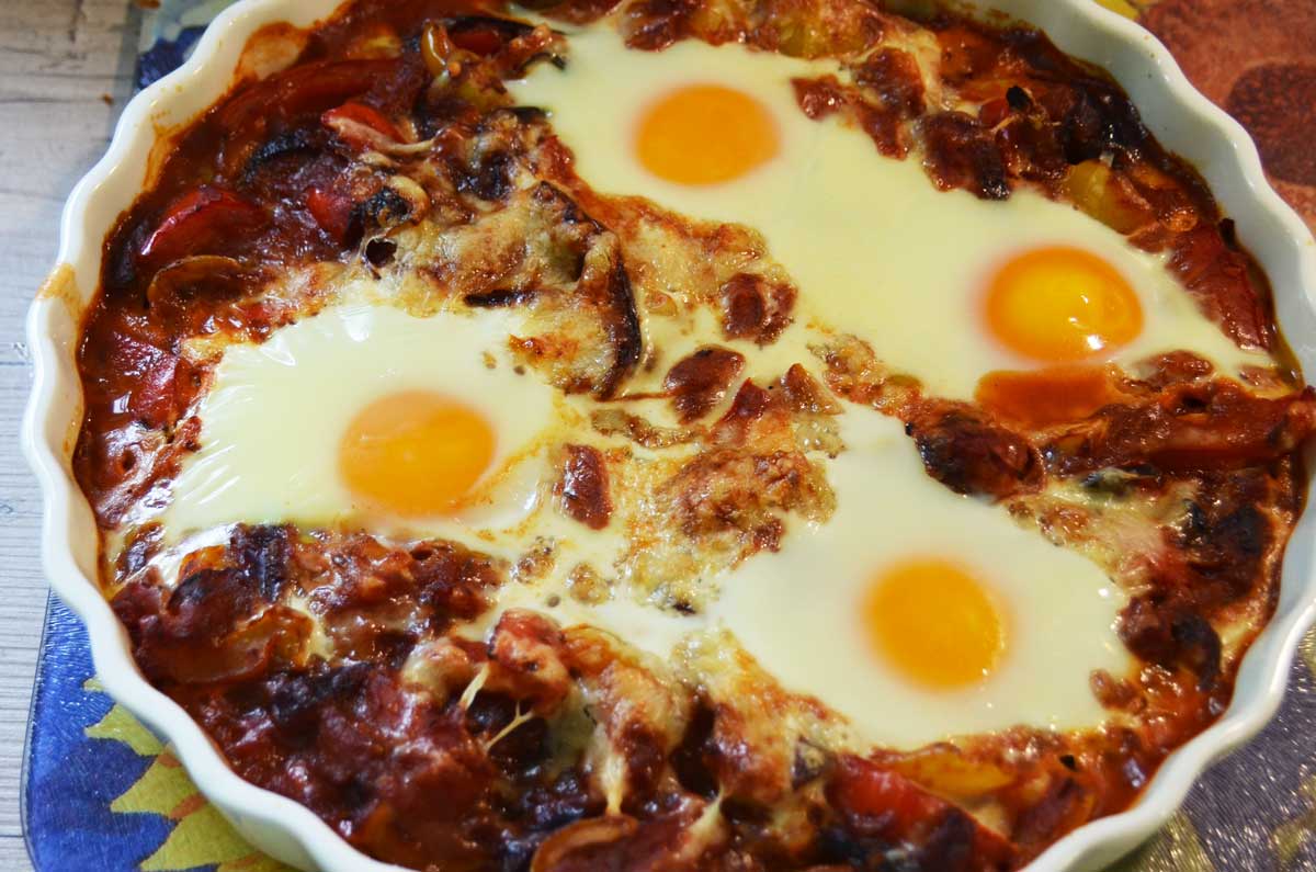 four eggs in a tomato and pepper sauce