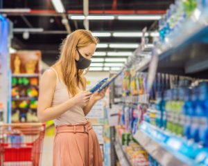 woman in shop wearing mask