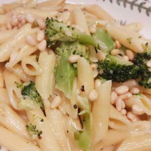penne pasat with broccoli and pine nuts in a cream sauce