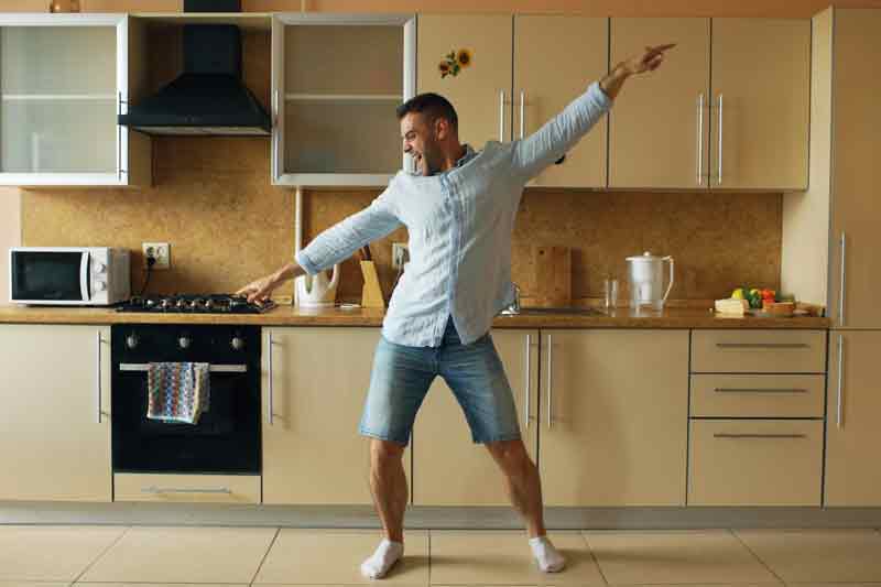 man dancing in kitchen