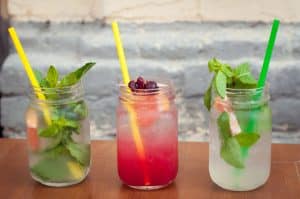 theree cocktail drinks with herbs