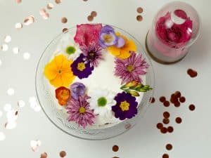large cake with colourful flowers on top